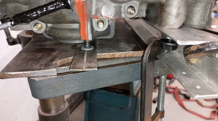 clamped and shimmed to drill press.png